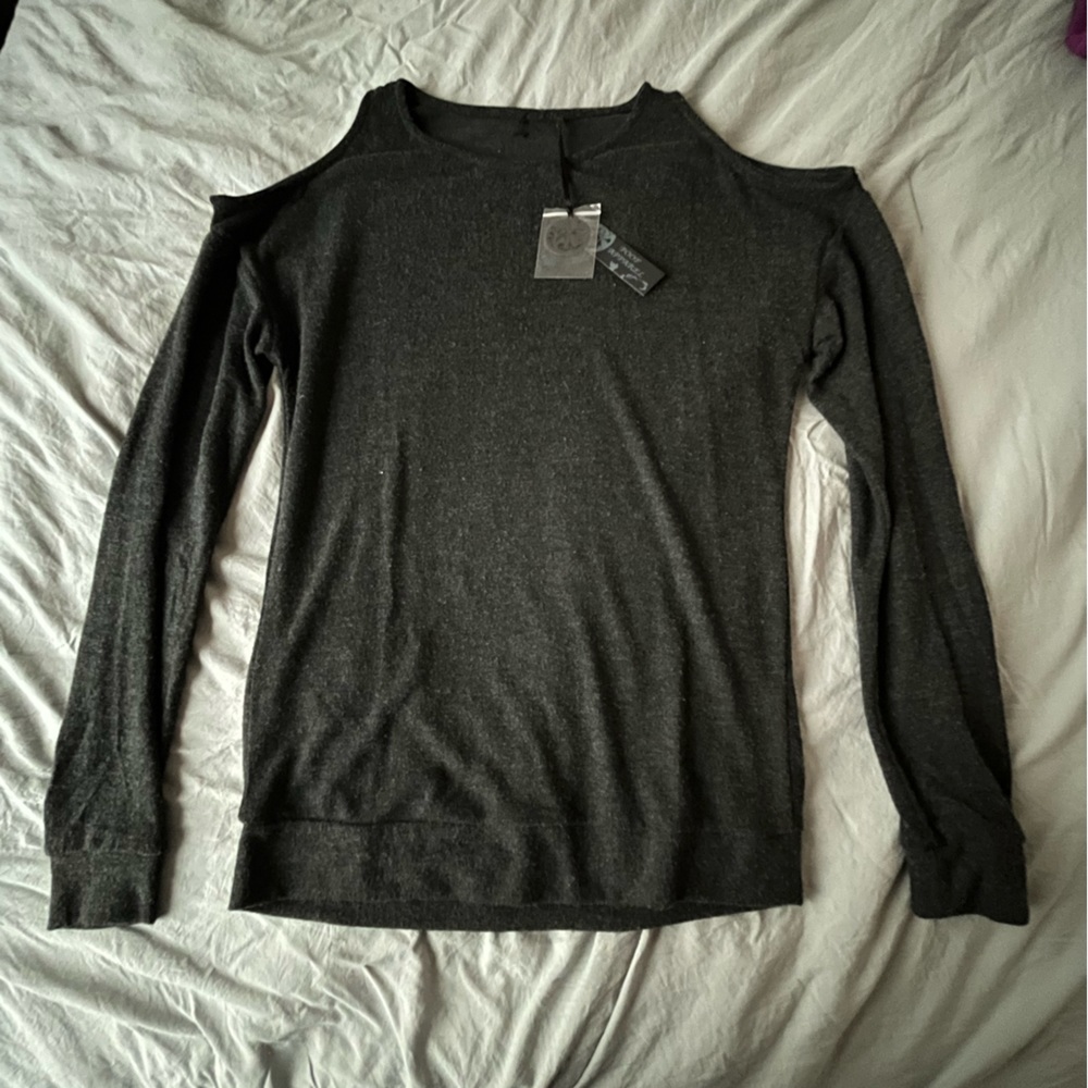 New W/O Tags. Shoulder Cap Revealing Black Long Sleeve.